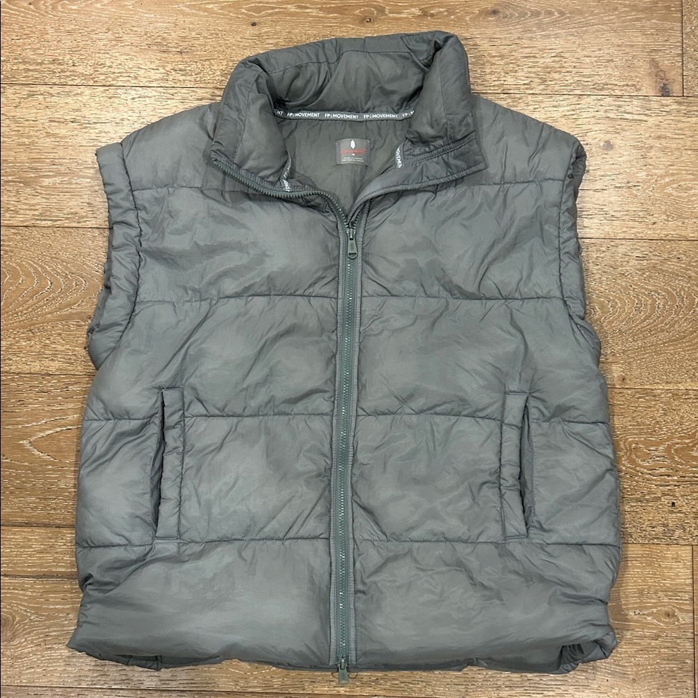Free people movement in a bubble puffer vest